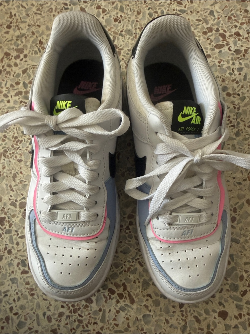 Nike white low-top sneakers with pink, blue & black accents